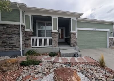 front of home with new green paint