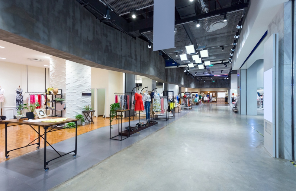 interior of shopping center with displays in the aisle and faux finish paint