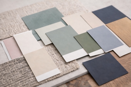 Paint color swatches paired with fabric and wood samples for style-based color recommendations