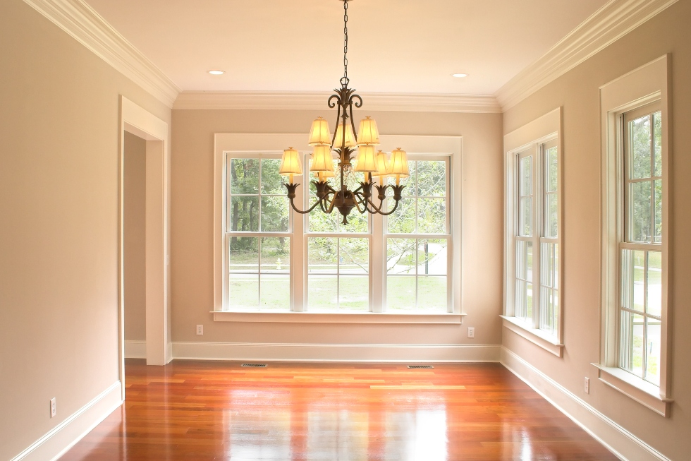 dining room with new window trim, crown molding and baseboards