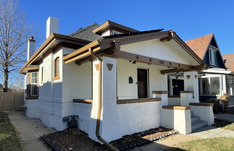 home painted white with brown accents