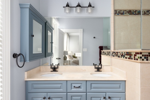 light blue painted cabinets in bathroom