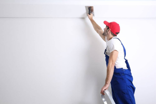 Sanding: Smoothing Out Popcorn Ceilings for a Modern Look